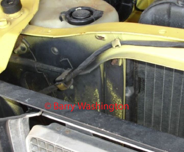 Attached picture Low mile TA blackout on top of lower radiator support flange area w.jpg